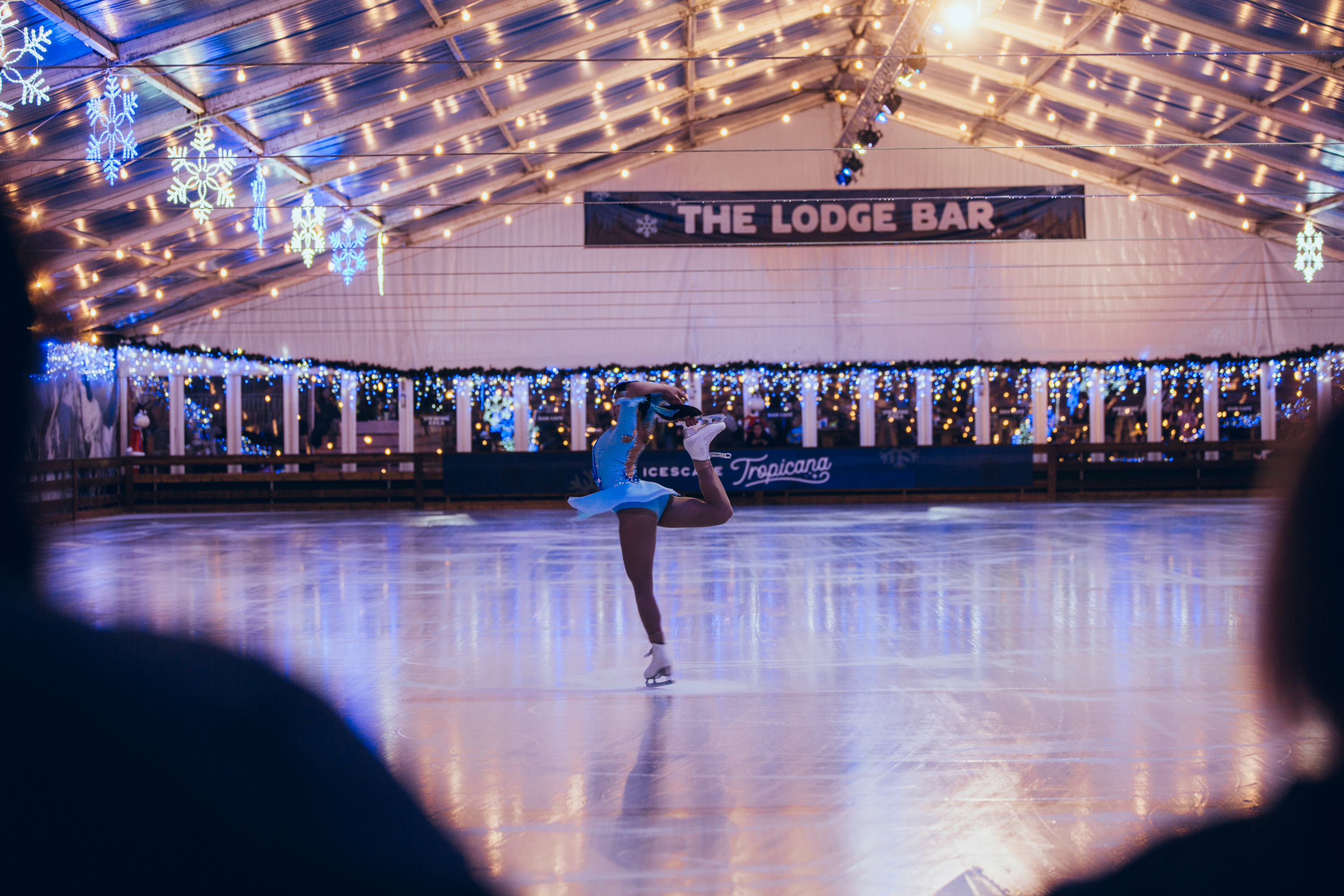 A professional ice skater performs a routine at Icescape Tropicana 2024. 